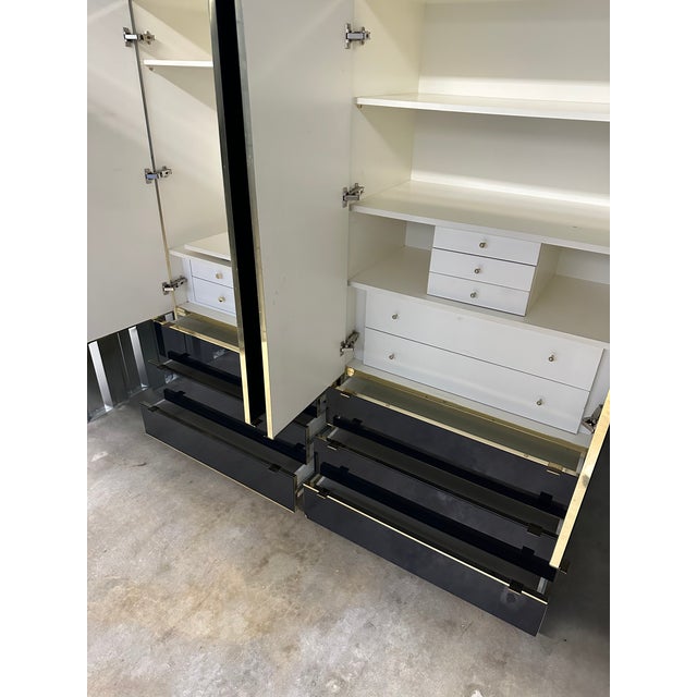 Gorgeous pair of Ello Wardrobe Cabinets. the glass door and drawer fronts are navy blue and absolutely gorgeous. The brass...