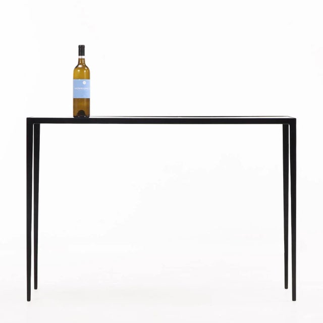 A refined pair of contemporary console tables inspired by the understated luxury of Jean-Michel Frank. Each features a...