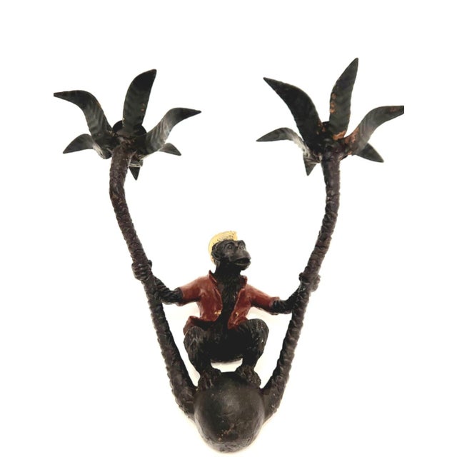 This vintage pair of cast iron sconces feature pirate monkeys dressed in red coats and little yellow caps. Seated atop...