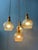 Hustadt Leuchten vintage cascade chandelier with 4 glass shades. The shades have a decorative shape and the glass has a...