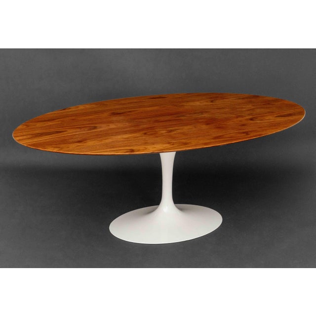 Eero Saarinen (Finnish/American, 1910-1961) by Knoll "Tulip" Dining Table, with white base and oak top, Knoll label to...