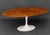 Eero Saarinen (Finnish/American, 1910-1961) by Knoll "Tulip" Dining Table, with white base and oak top, Knoll label to...