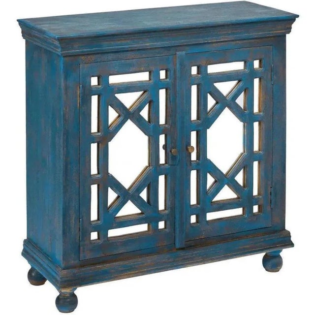 Create a lavish retreat within your bedroom with our 40" Distressed Kelan Navy Blue Mirrored Overlay Doors Accent Cabinet....