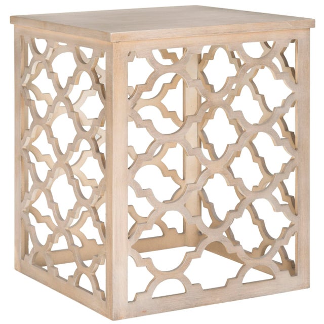 Inspired by a Moroccan iron architectural fragment, the grille effect of the grey-finished end table brings a open and...