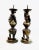 Pair of Chinese bronze pricket candleholders featuring the imperial dragon chasing the flaming pearl of immortality. These...