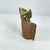 Hand-forged metal bell used by herders in rural Ghana to help locate goats and other livestock while grazing. Attached to...