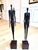 Pair of vintage American Brutalist sculptures depicting elongated male and female figures. Dating to the 1980s, each is...