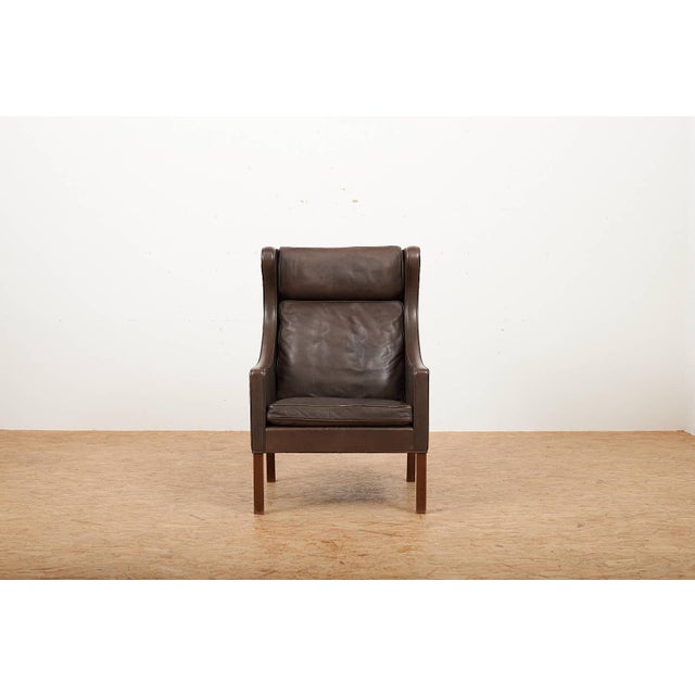 Model 2204 Wingback Armchair in Leather with Wood Legs by Børge Mogensen for Frederica, 1963, in Good conditions. Designed...