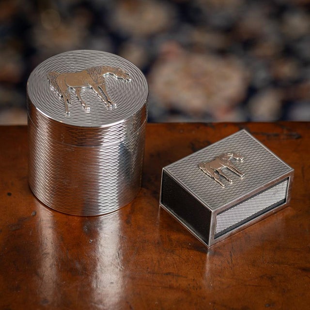 A vintage mid-20th century hermes cigarette box and matchbox holder crafted from solid silver, adorned with exquisite gold...