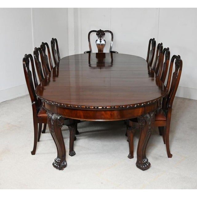 Superb Chippendale style mahogany dining table and chairs by Gillows of Lancaster The pieces bearing the prestigious...