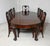 Superb Chippendale style mahogany dining table and chairs by Gillows of Lancaster The pieces bearing the prestigious...