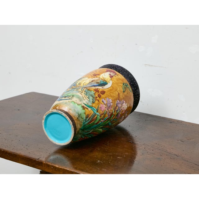 Richly colored and deeply textured, this French Majolica vase dates to circa 1900 and presents a striking tableau of...