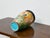 Richly colored and deeply textured, this French Majolica vase dates to circa 1900 and presents a striking tableau of...