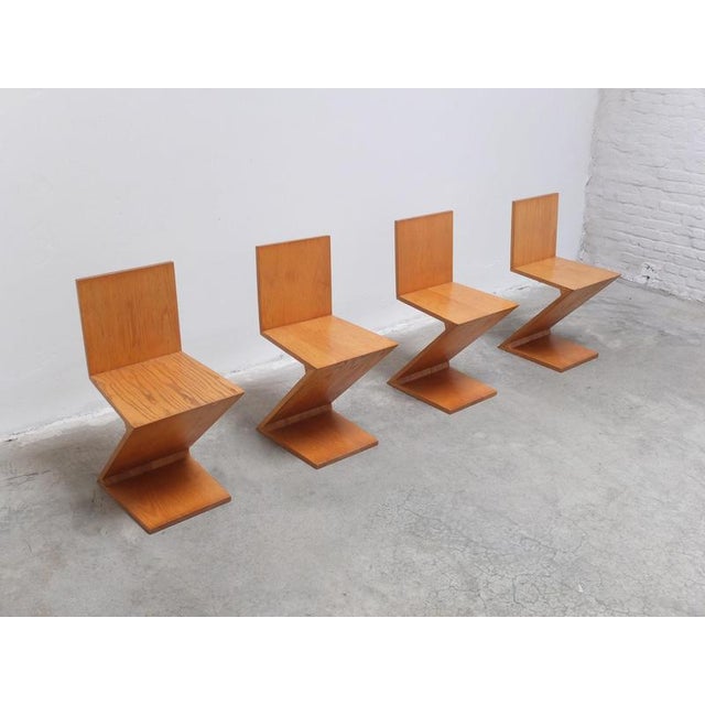 Beautiful set of 4 ‘Zig Zag’ chairs designed by Gerrit Thomas Rietveld in 1934. A true design icon which captures the...