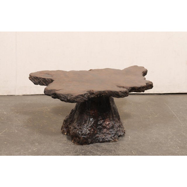 An American cypress wood coffee table with live edge, from the early to mid-20th century. This antique coffee table has...