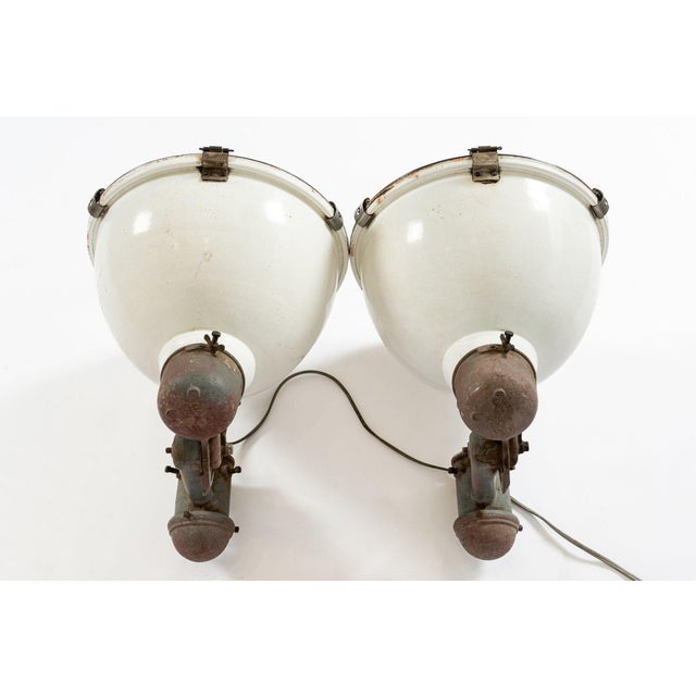 Incredible pair of very large vintage industrial floodlight lamps made by Westinghouse. Original concave heavy glass...