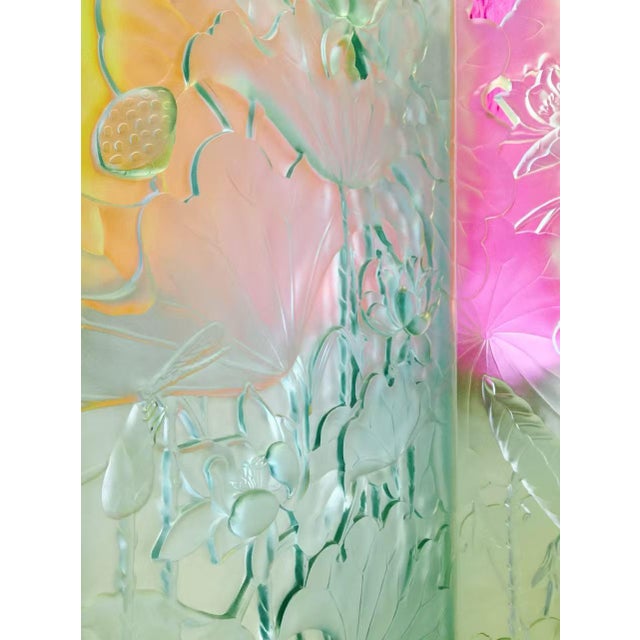 A striking set of three sculptural glass panels featuring intricate hand-carved floral relief, designed to function as...