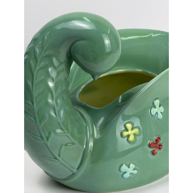 A mid-century modern ceramic dove sculpture produced by Beswick in England during the 1950s, featuring a stylized bird...