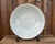 An impressive antique Chinese Longquan celadon charger dating to the Ming dynasty, 1368–1644, distinguished by its...