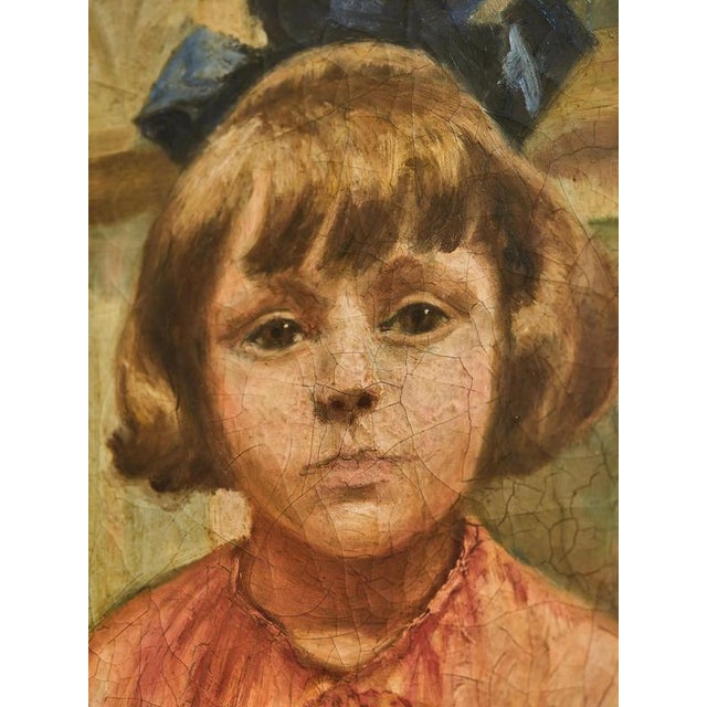 Portrait of a Little Girl from 1924 is a beautiful oil painting by the painter E. Walraven. This signed painting depicts a...