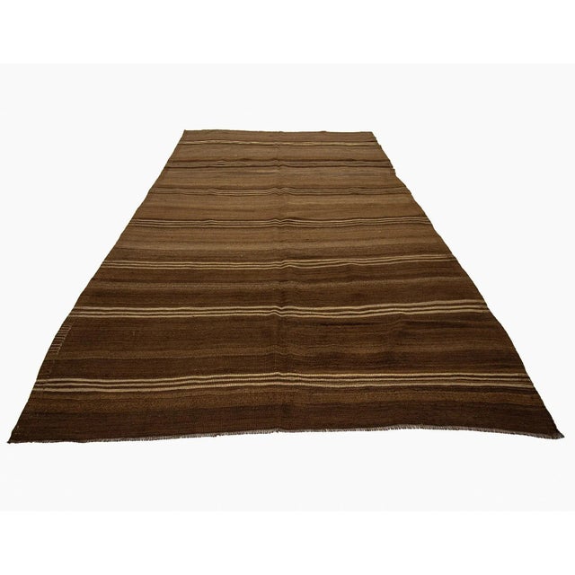 Vintage hand woven striped wool Kilim rug from Kars region of Turkey. Approximately 50-60 years old. In very good condition