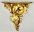 Mid Century Italian carved gilt wood wall bracket with a lovely Neoclassical design. This large scroll form classical wall...