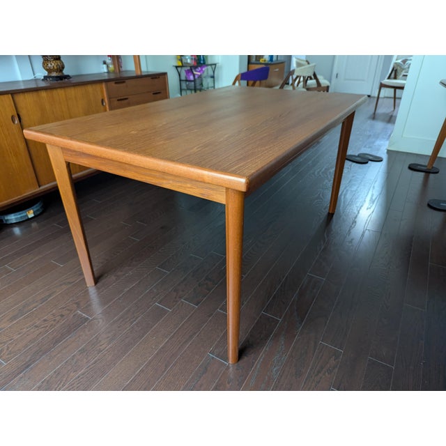 This exceptional single-owner Danish Modern draw-leaf dining table was manufactured by Brdr. Furbo in Spøttrup, Denmark....