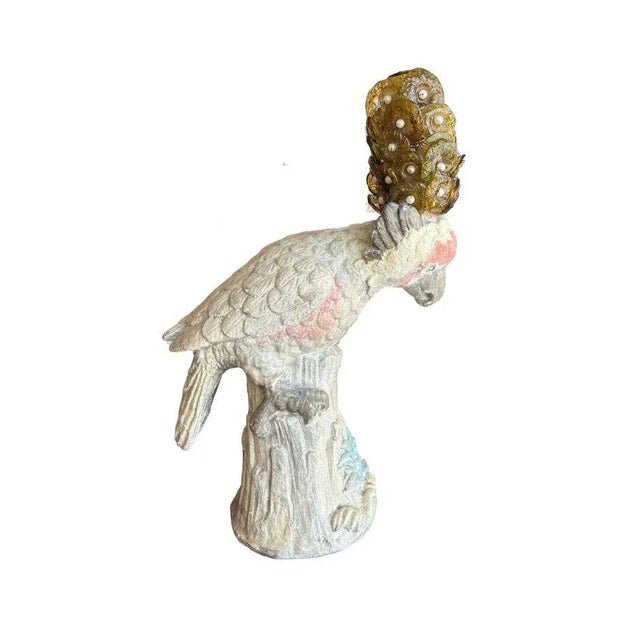 This 1960s distressed cockatoo sculpture features a pastel-painted bird perched on a textured tree stump, exuding vintage...