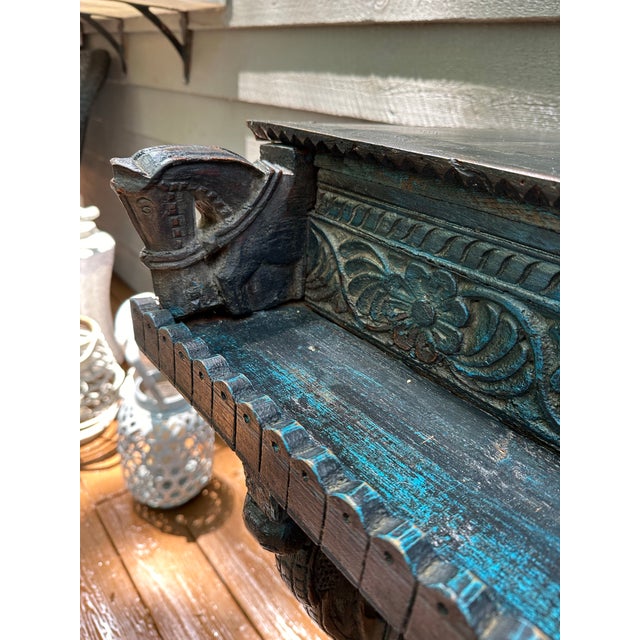 Very unique and intricately carved altar table with unusual glaze that highlights birds, horses and elephants carved into...