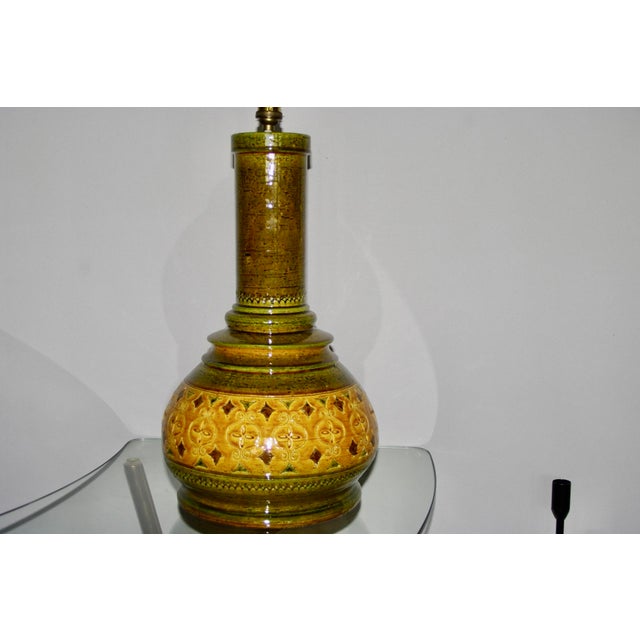 Large Italian ceramic lamp by Aldo Londi in mustard and green, in very good condition This piece has an attribution mark,...
