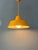 Classic small industrial style yellow pendant lamp. The lamp is made out of metal and has a yellow lacquer. The lamp...