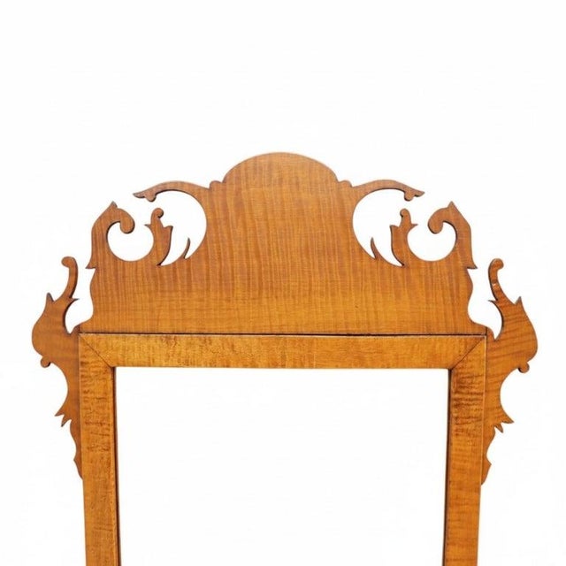 A distinguished antique Federal period mirror, dating to the 19th century, presents a striking example of American...