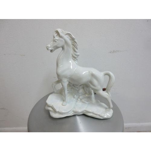 Up for consideration is this Mid-century porcelain lamp. Shaped like a stallion horse, it is in great shape with minor wear.