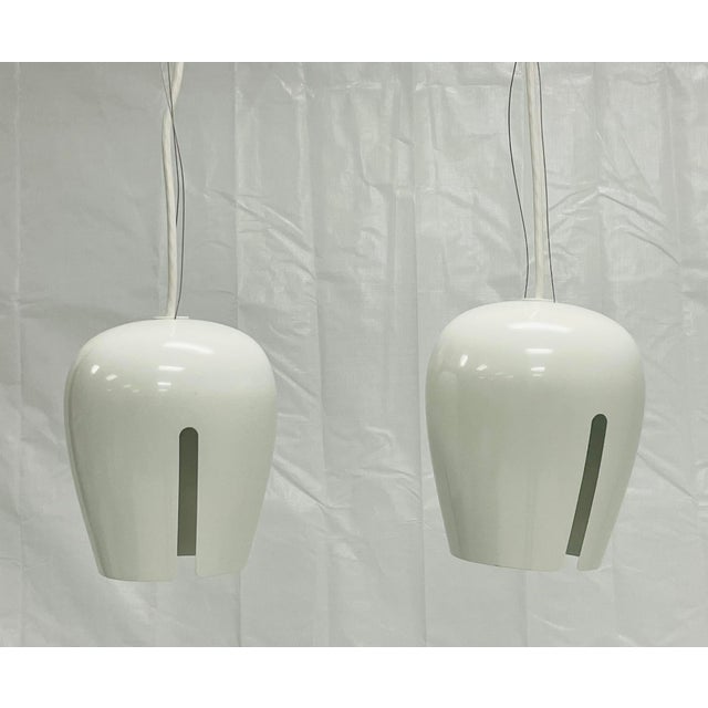 Elegant pair of “Zita” pendant lights designed and manufactured by Molto Luce in Austria. These sculptural fixtures embody...