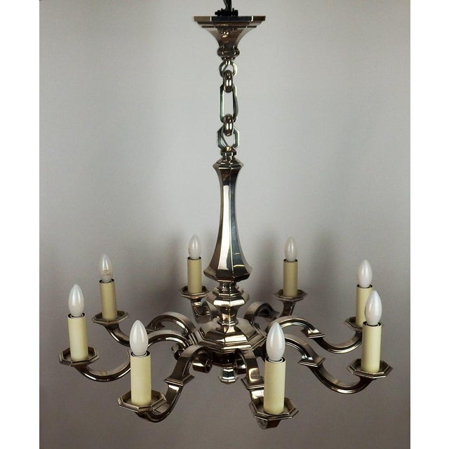 Art Deco chandelier in silvered bronze in the style of elegant 1930s silverware. Central baluster-shaped and polygonal...