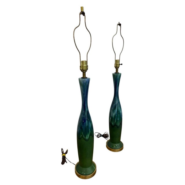 Elevate your interior with this striking pair of Mid-Century Modern Royal Haeger drip glaze table lamps. Featuring tall...