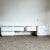Discover the versatility and style of these Postmodern Oversized White Lacquer Laminate and Chrome Nightstands/Dressers....