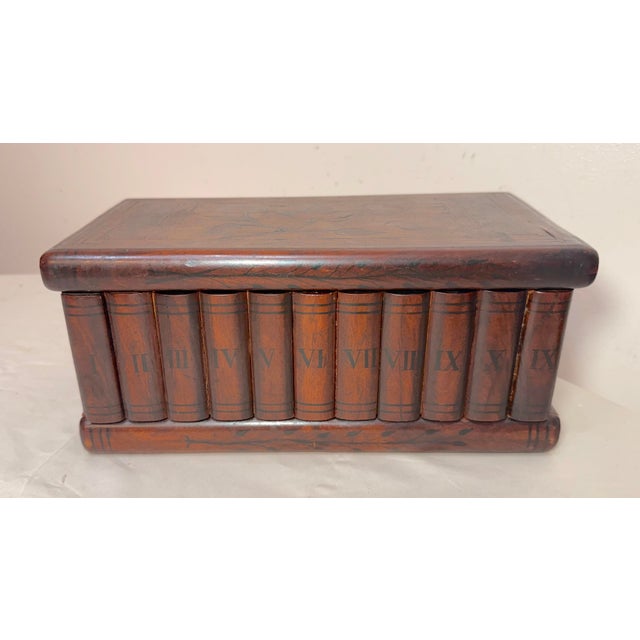 This antique 19th century handmade inlaid marquetry wooden book shelf shaped jewelry box is a unique and stylish piece of...