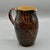 A substantial antique Royal Doulton Lambeth stoneware pitcher decorated in the celebrated Natural Foliage Ware technique,...