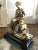 Up for sale is an antique French figural mantel clock, featuring a statue of a Pandora, seated with her box. This piece is...