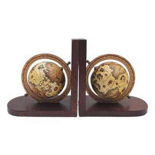 Vintage Old World Globe Bookends With Rotating Spheres and Brass Details on Wood For Sale