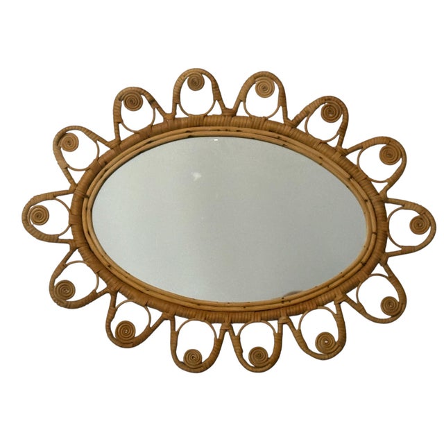 Magnificent oval rattan mirror from the 1950s. Handcrafted in the south of France.