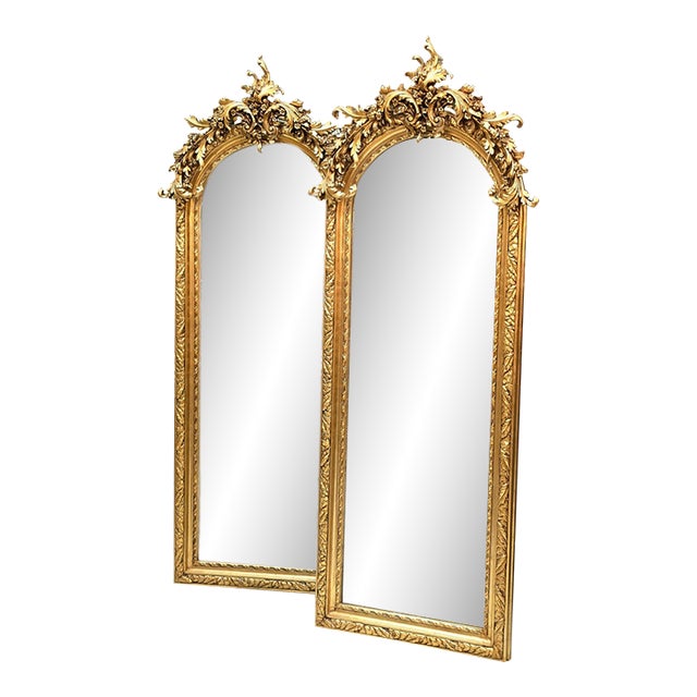 Grand French-Style Gilded Wall Mirror – Ornate Floral Crest, Sculpted Foliage & Gold Leaf Frame For Sale
