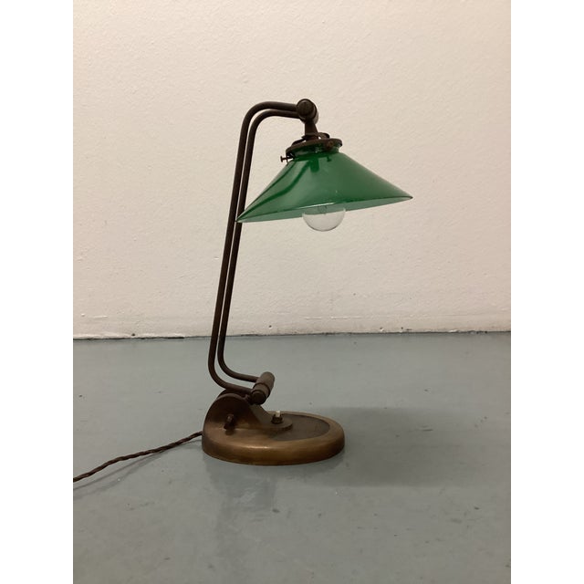 Rare Table Lamp in Brass With Original Green Glass Shade. Italy, 1940s Unique base shape with handcrafted details. A...