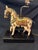Whimsical mid-century table lamp featuring a beautifully carved and hand-painted wooden horse adorned with intricate folk-...