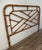 This striking vintage bamboo and rattan headboard features a classic Chippendale-inspired fretwork pattern, handcrafted...