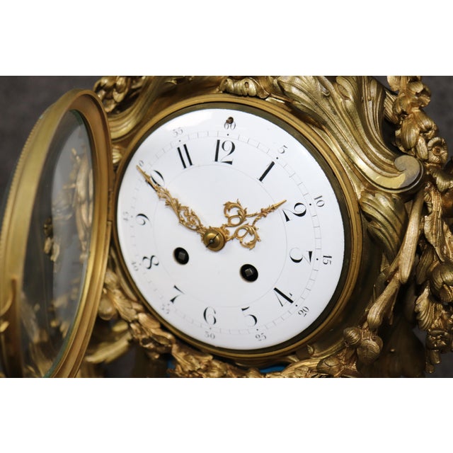 There are mantel clocks… and then there are mantel clocks that look as though they once kept time for someone wearing...