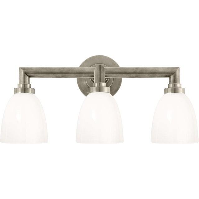 Wilton Triple Bath Light in Antique Nickel with White Glass Designer: Chapman & Myers Height: 10.5" Extension: 8.5"...