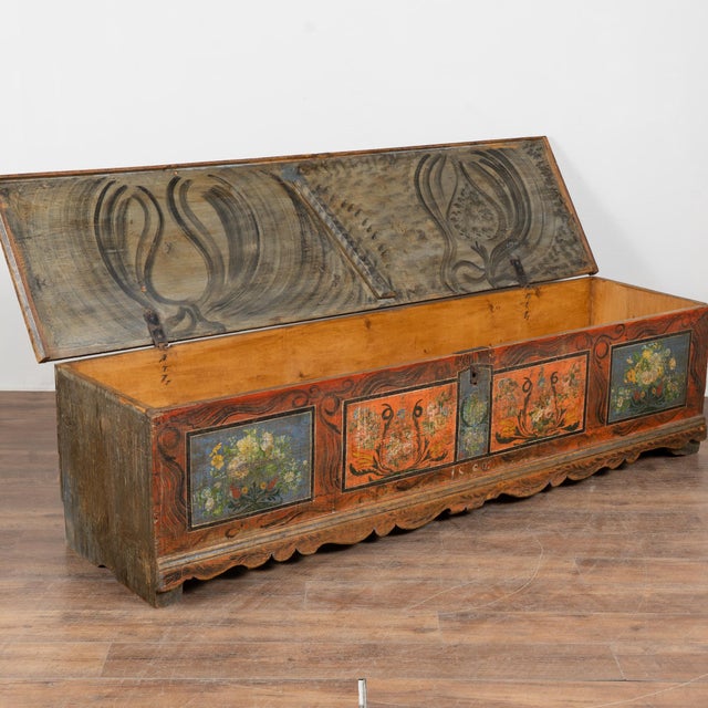 The painted finish is all original on this rustic pine flat top narrow trunk which may also serve as a bench. Flowers were...