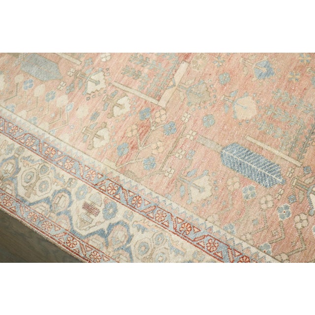 1920s Persian Heriz rug with an all over design in predominant pinks , creams and soft blues